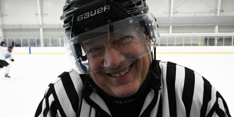 A ref smiling.