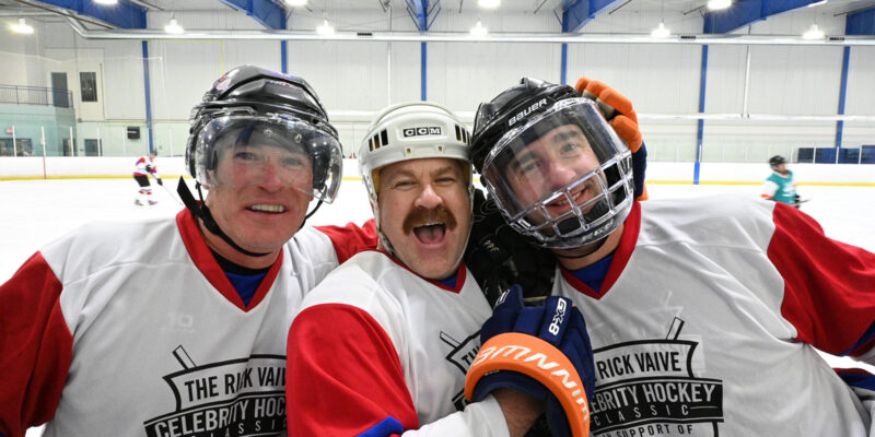 Three players smiling.