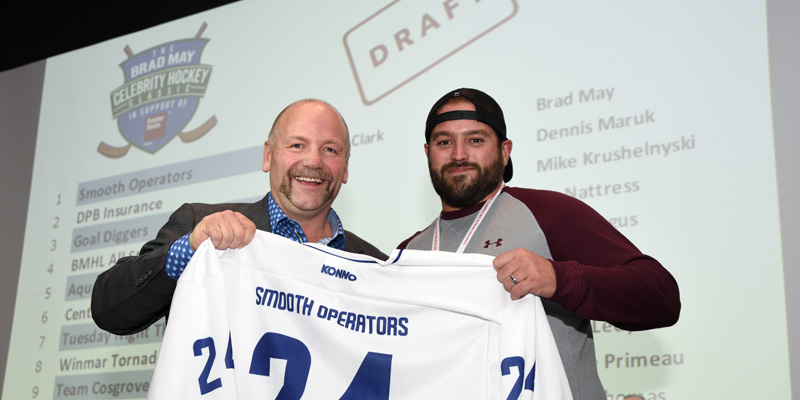 Wendel Clark accepts a jersey at a draft party